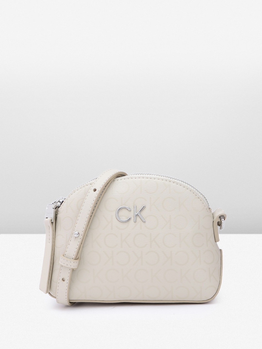 

Calvin Klein Brand Logo Printed Sling Bag, Off white
