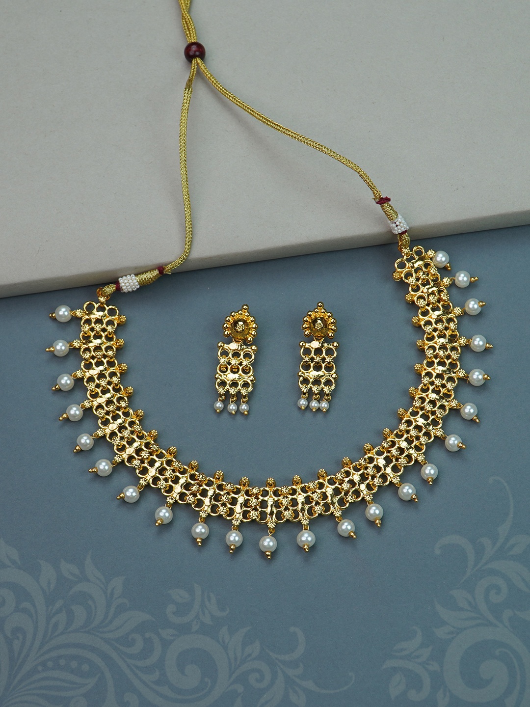 

Diksha collection Gold Plated Stones Studded & Beaded Jewellery Set