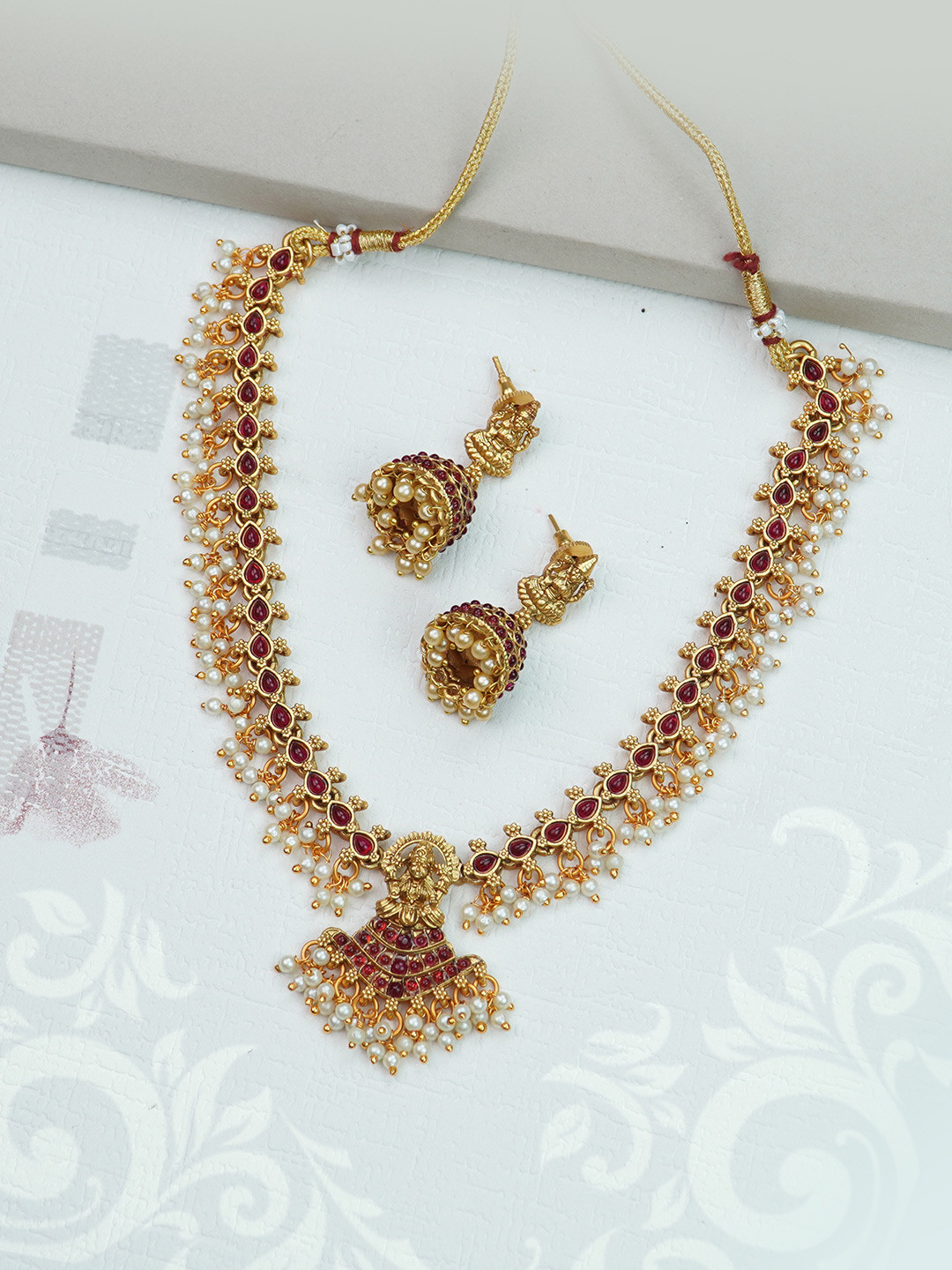 

Diksha collection Gold Plated Stones Studded & Beaded Jewellery Set