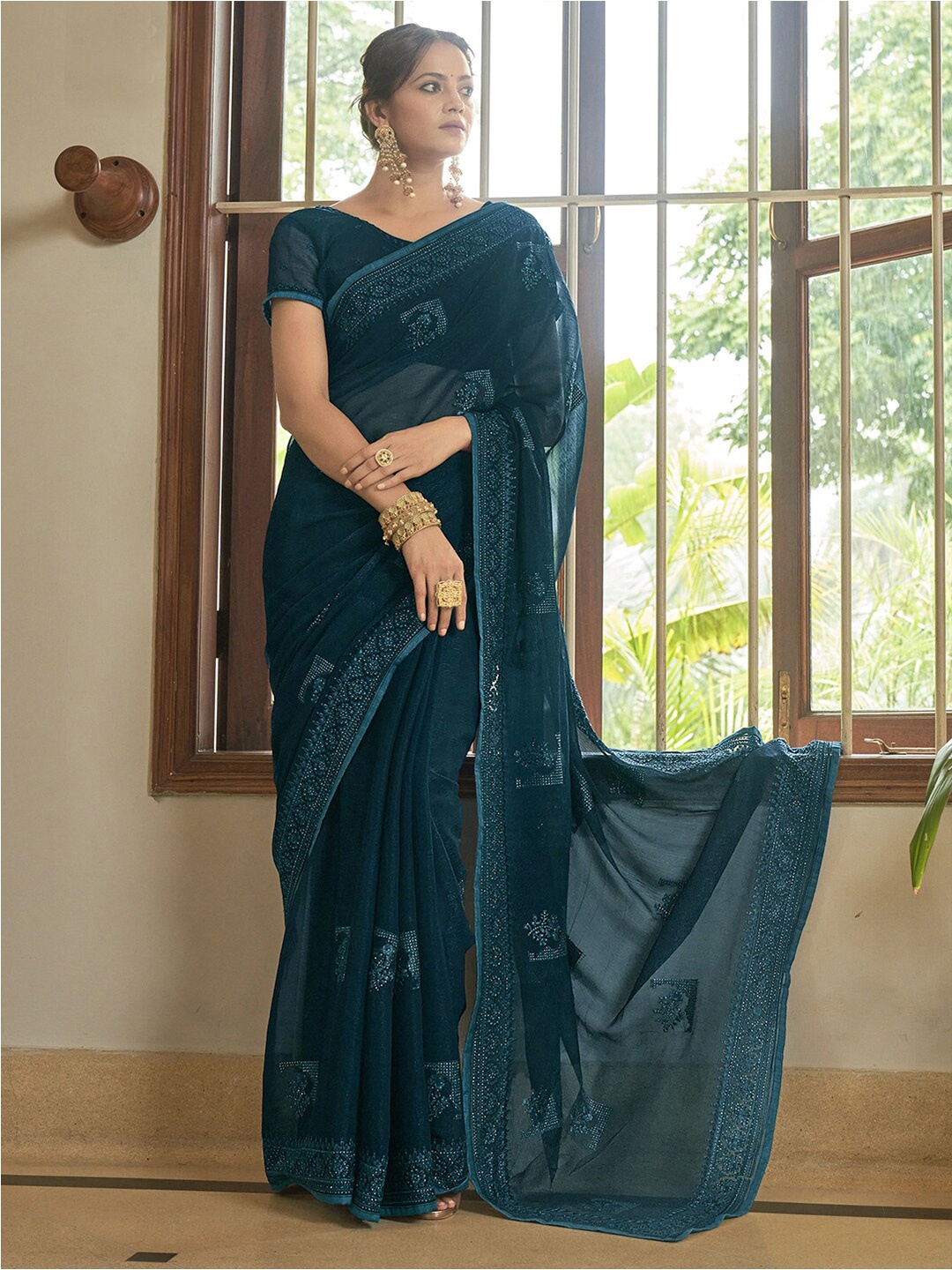 

Mitera Teal Ethnic Motifs Beads And Stones Embellished Saree