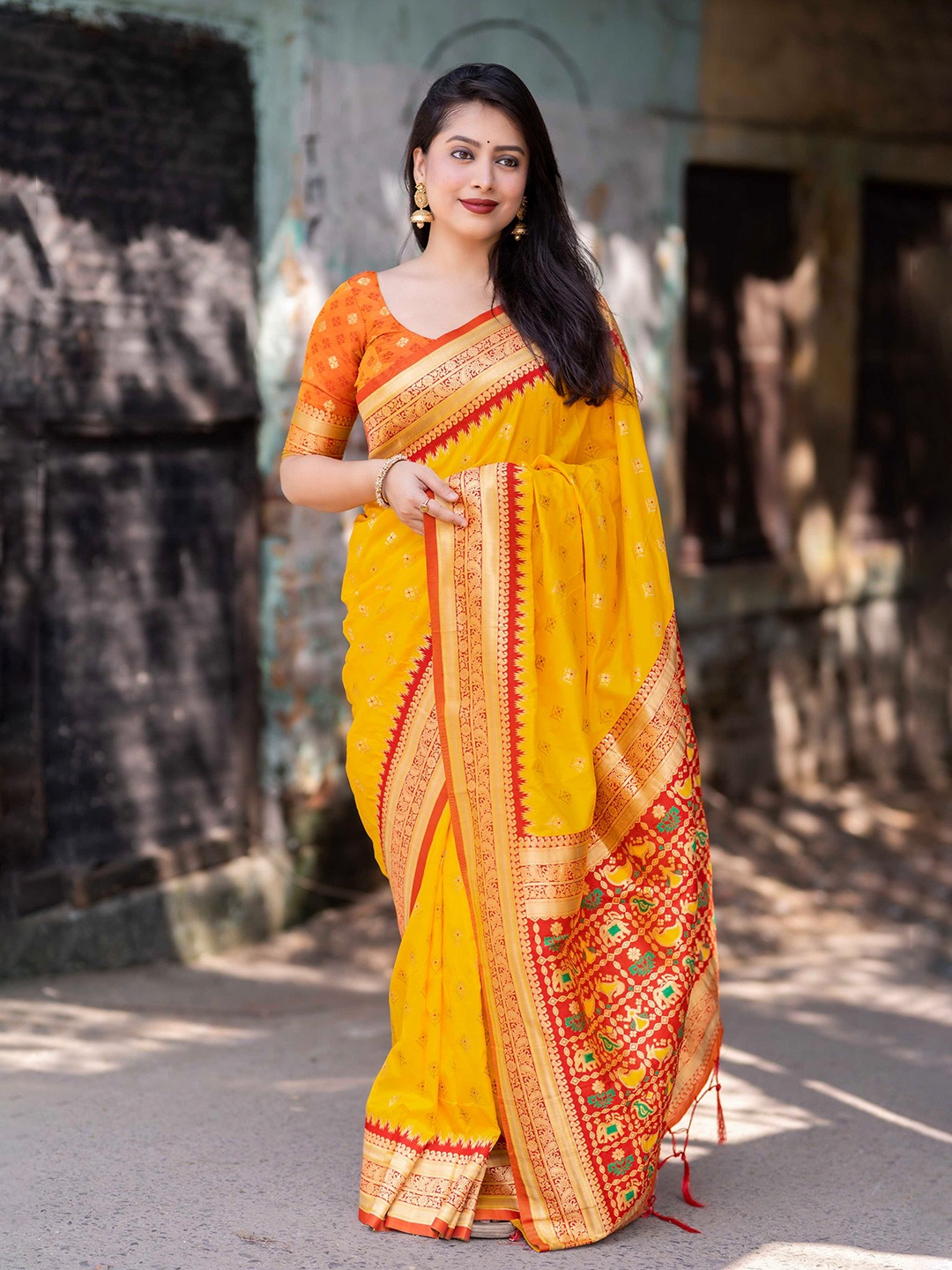 

Mitera Yellow Ethnic Motifs Woven Design Zari Silk Patola Saree