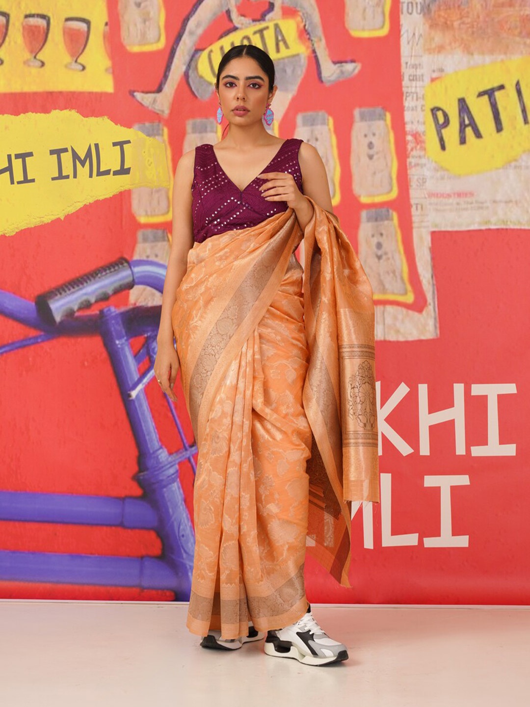 

Tikhi Imli Peach Floral Woven Design Zari Organza Saree