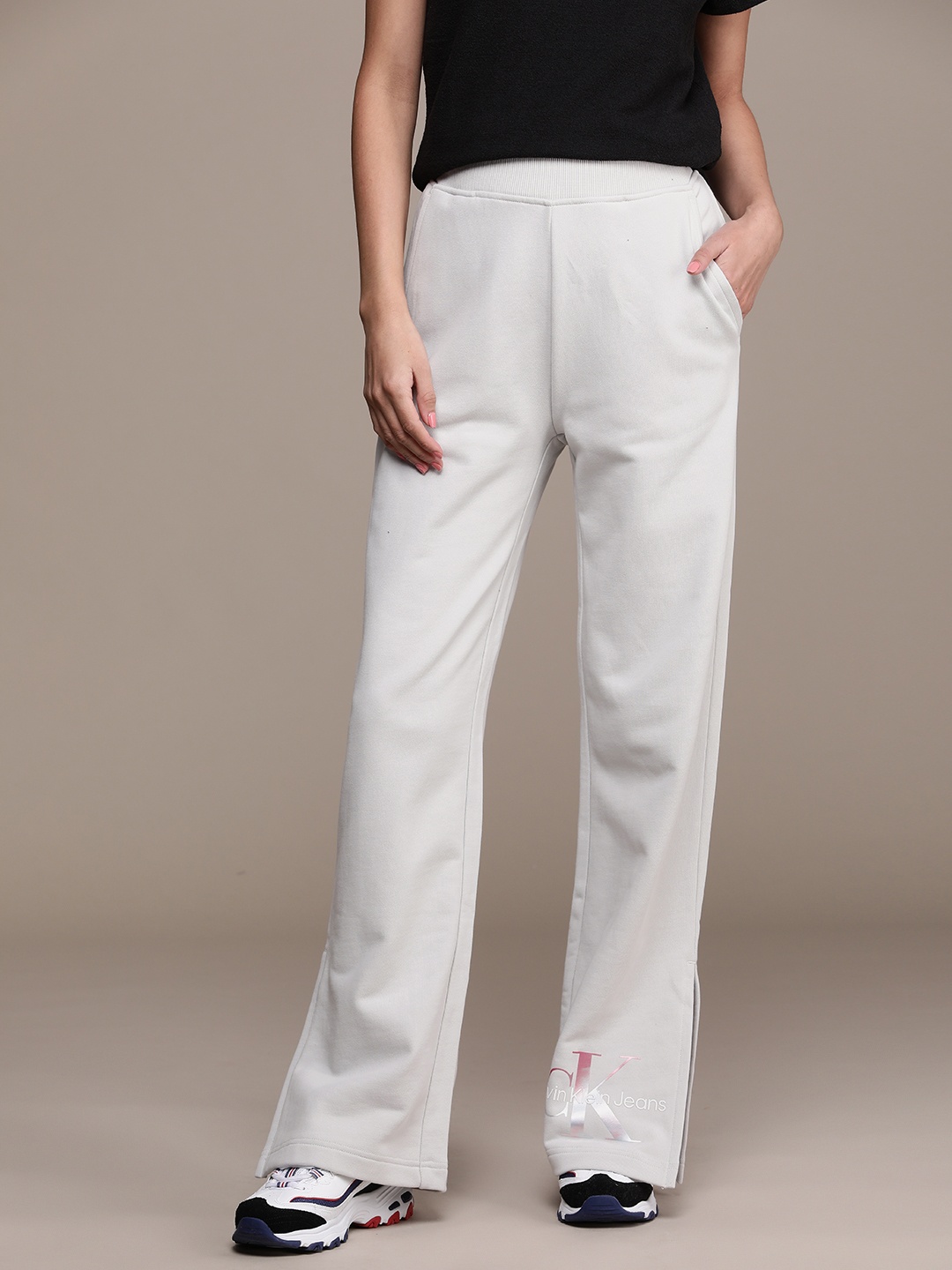

Calvin Klein Jeans Women Pure Cotton Flared Fit Mid-Rise Track Pants, Grey