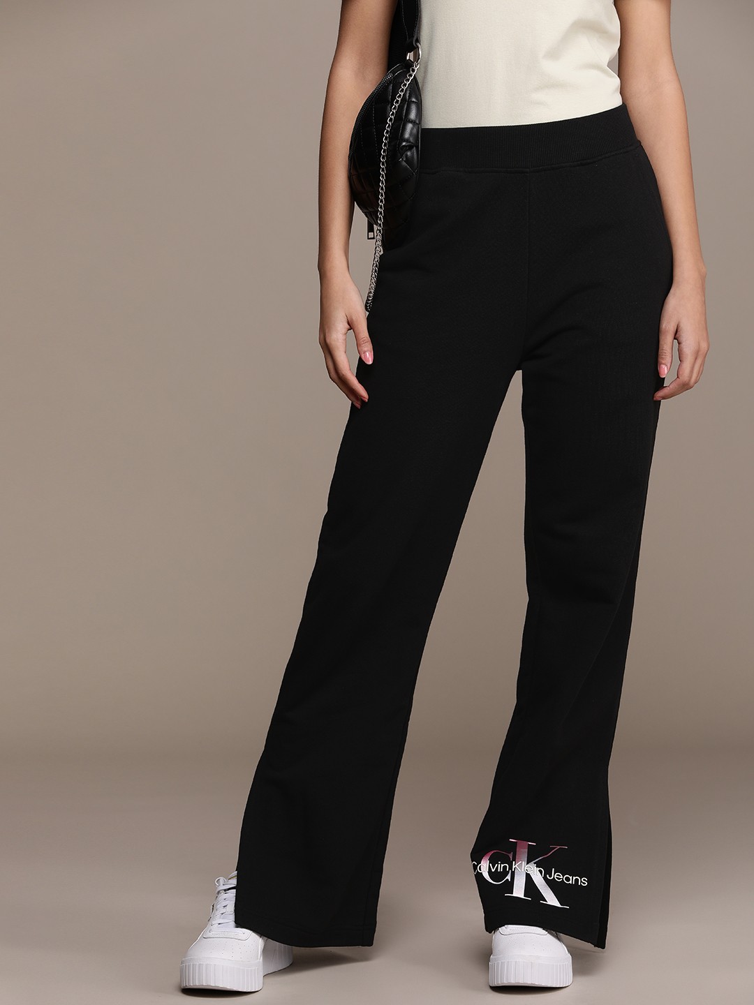 

Calvin Klein Jeans Women Pure Cotton Flared Fit Mid-Rise Track Pants, Black