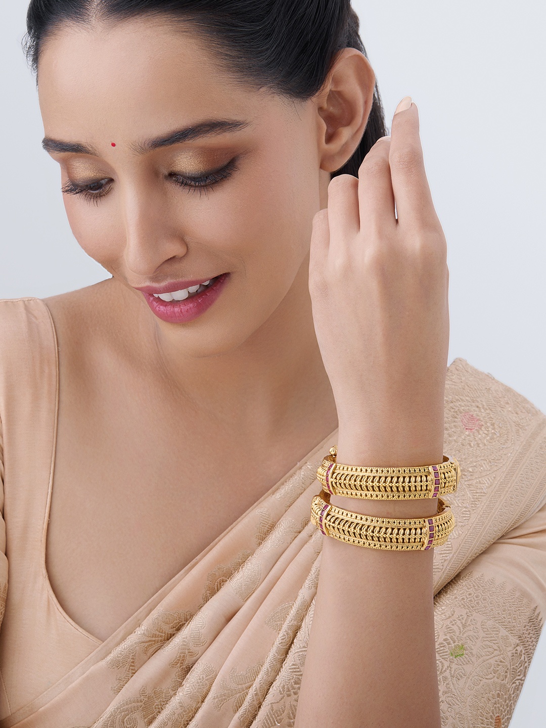 

Kushal's Fashion Jewellery Gold-Plated Stone-Studded Antique Bangles