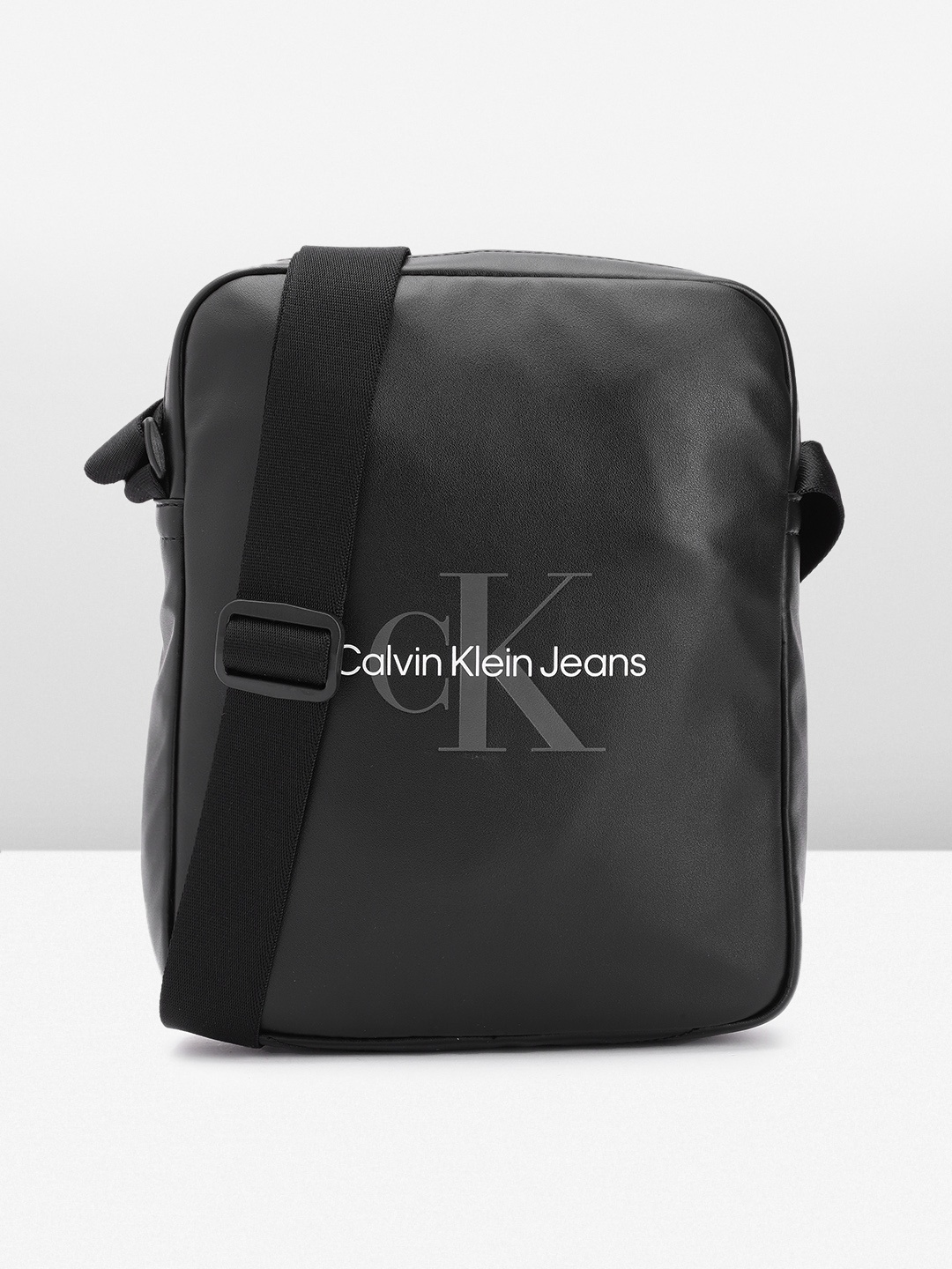 

Calvin Klein Men Brand Logo Printed Messenger Bag, Black