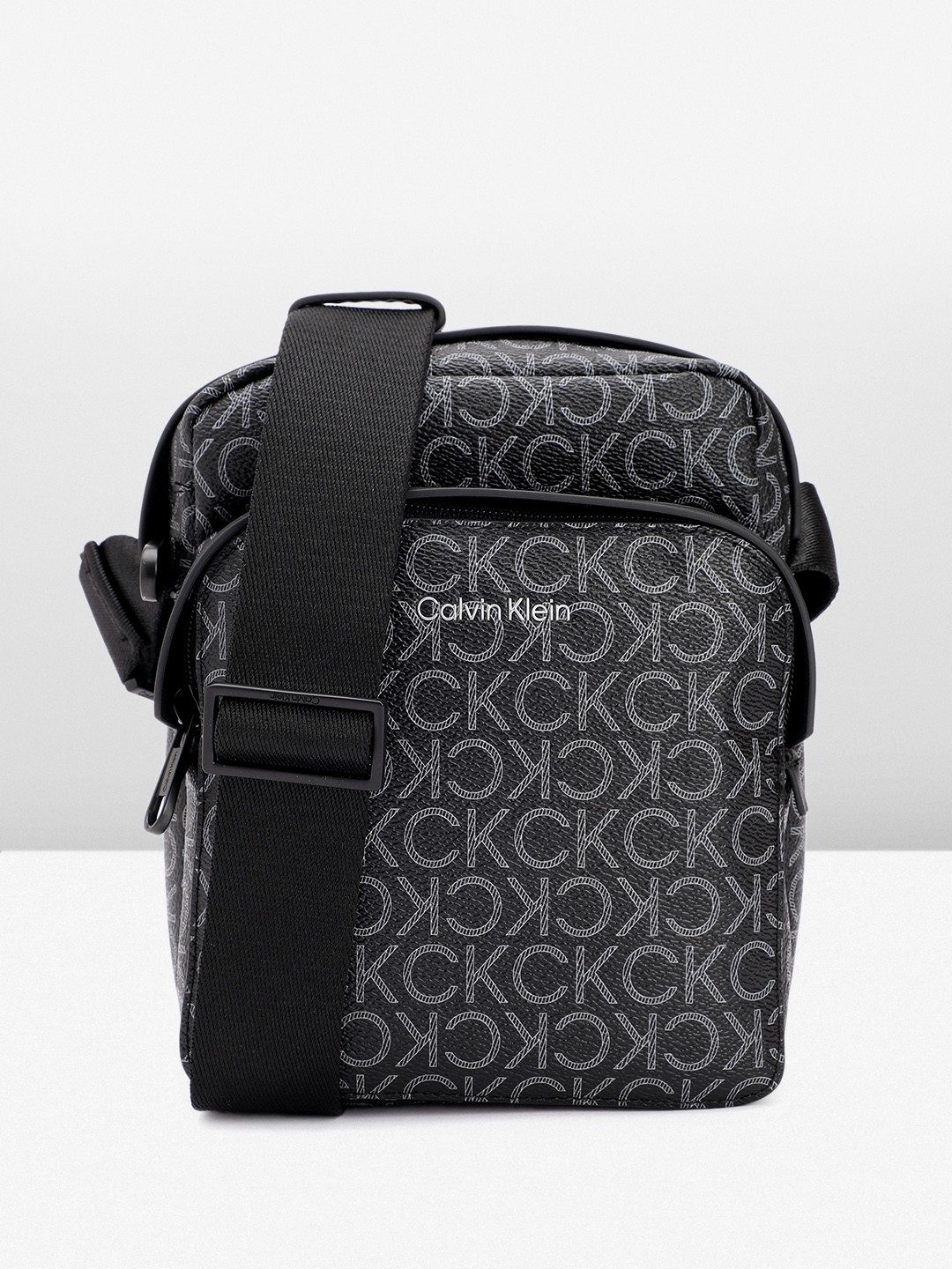 

Calvin Klein Men Brand Logo Printed Messenger Bag, Black