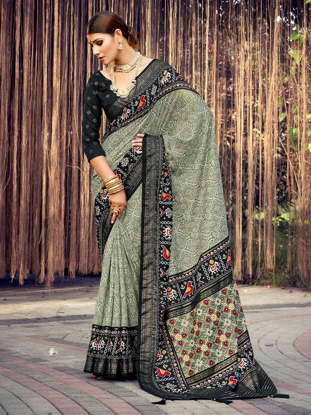 

Mitera Olive Ethnic Motifs Printed Woven Design Patola Saree