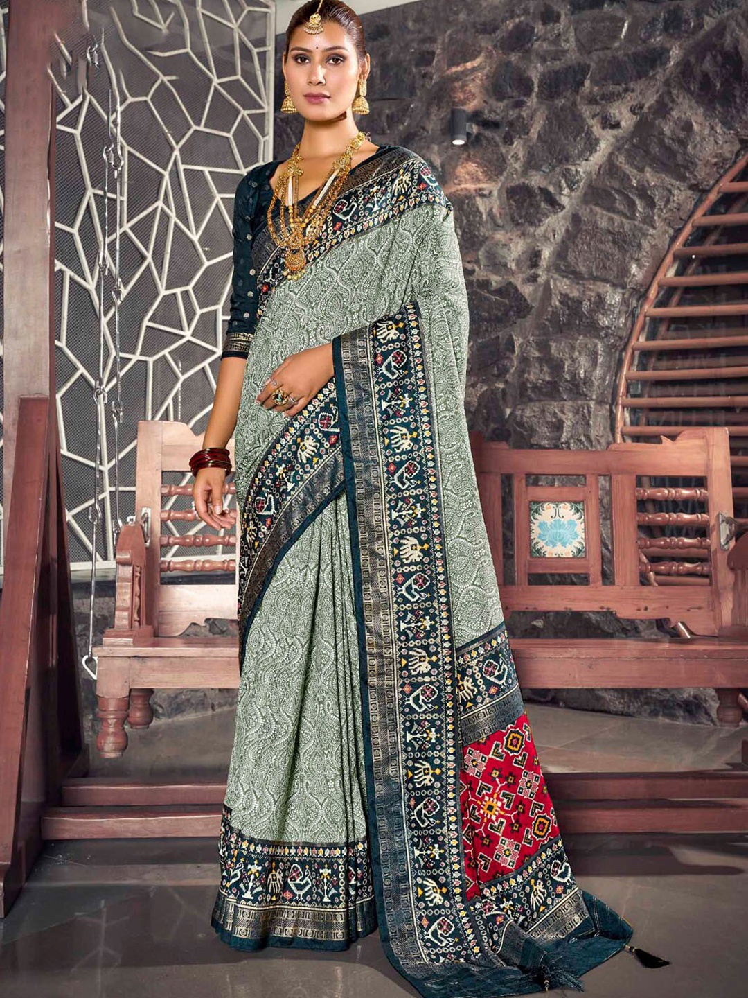 

Mitera Sea Green & Red Ethnic Motifs Printed Zari Silk Patola Saree