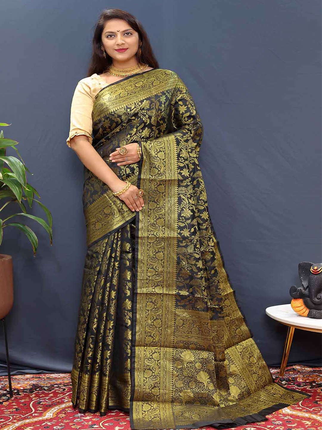 

Mitera Green & Gold Toned Floral Zari Art Silk Saree