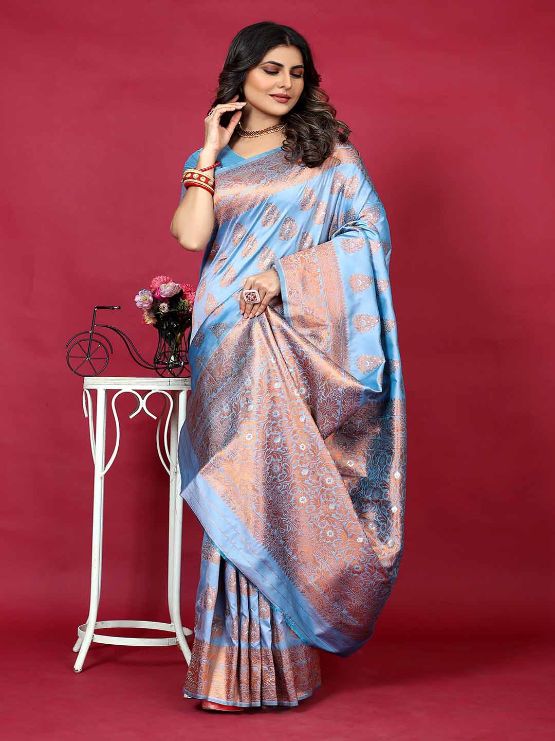 

Mitera Blue & Copper Toned Ethnic Motifs Ethnic Motifs Zari Art Silk Saree