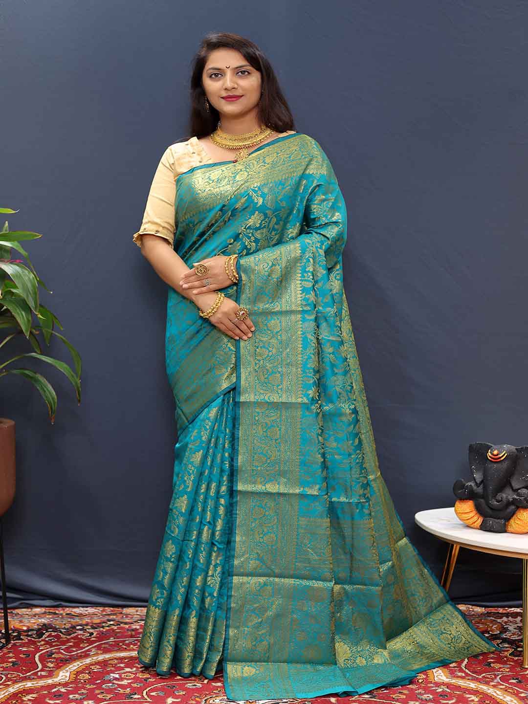 

Mitera Blue & Gold Toned Floral Zari Art Silk Saree