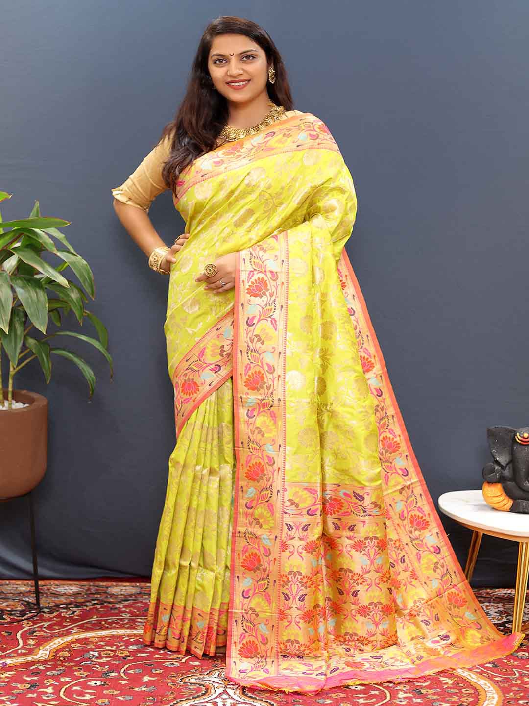 

Mitera Yellow & Pink Ethnic Motifs Woven Design Zari Art Silk Saree