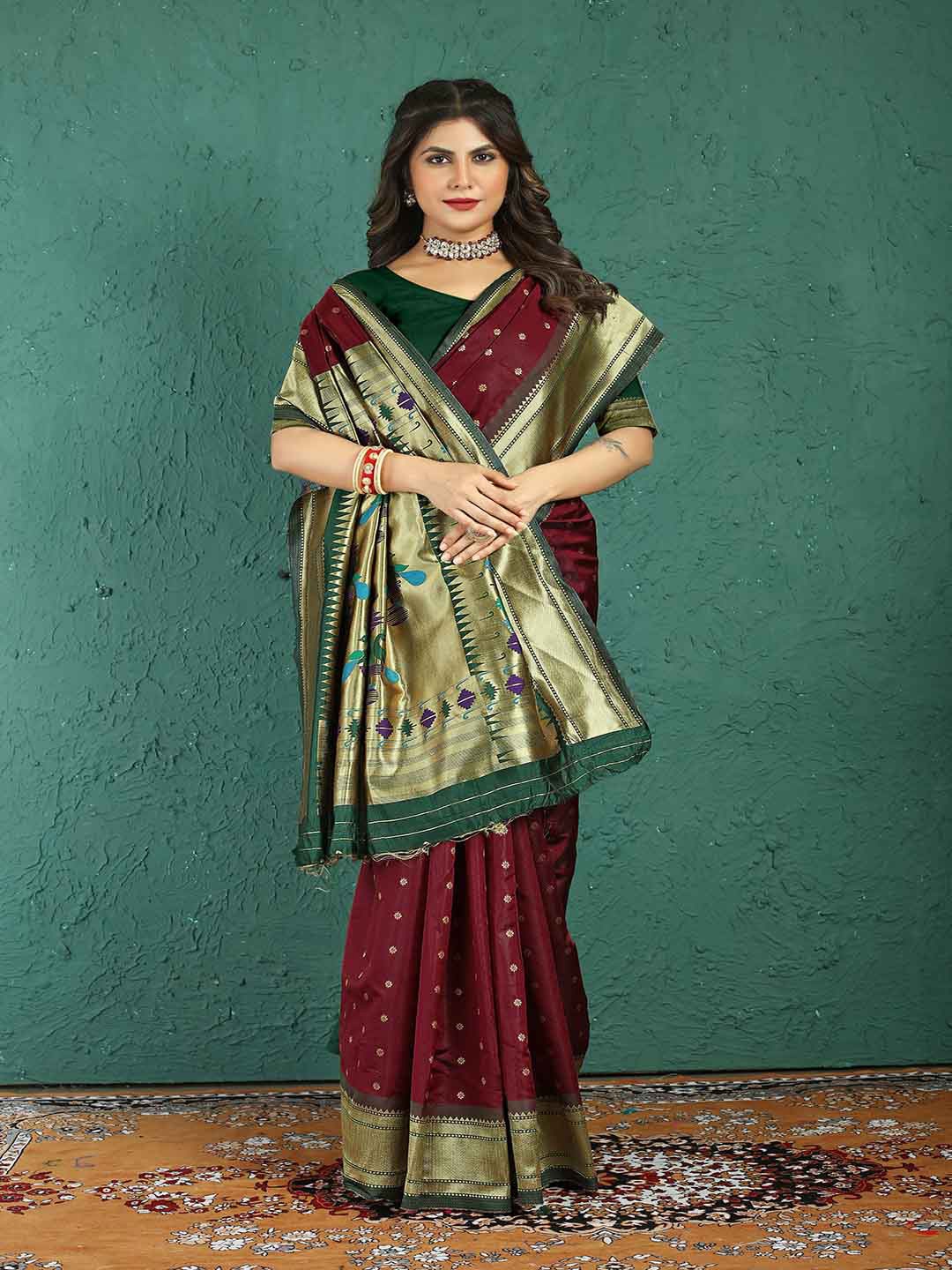 

Mitera Maroon & Green Ethnic Motifs Woven Design Zari Art Silk Saree