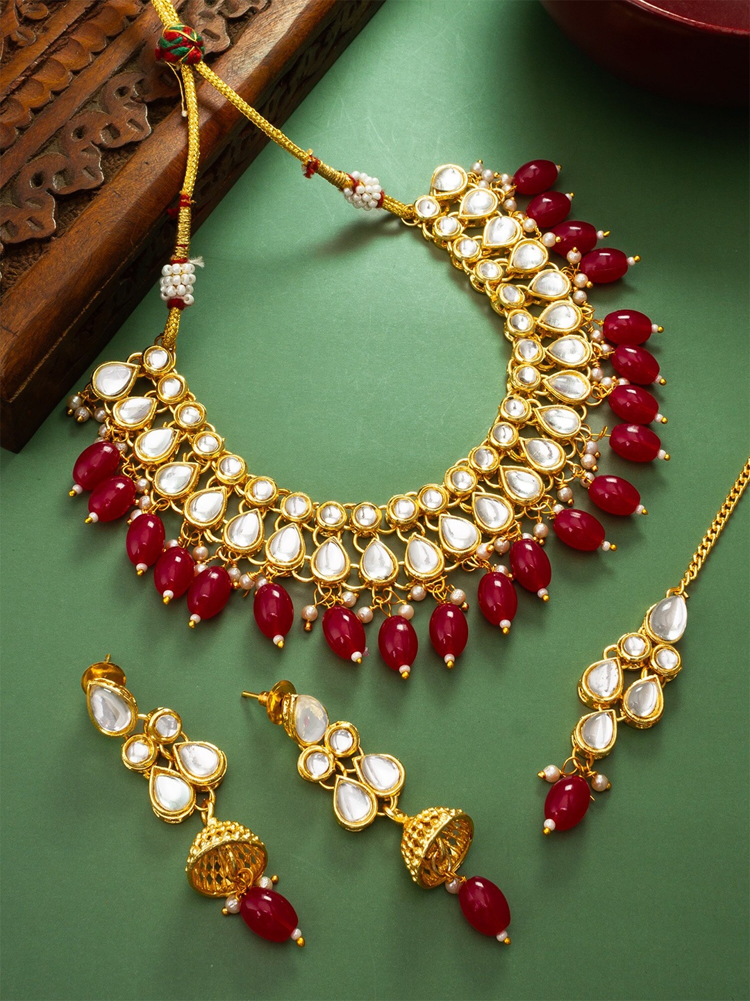 

aadita Gold-Plated Stone-Studded & Beaded Jewellery Set