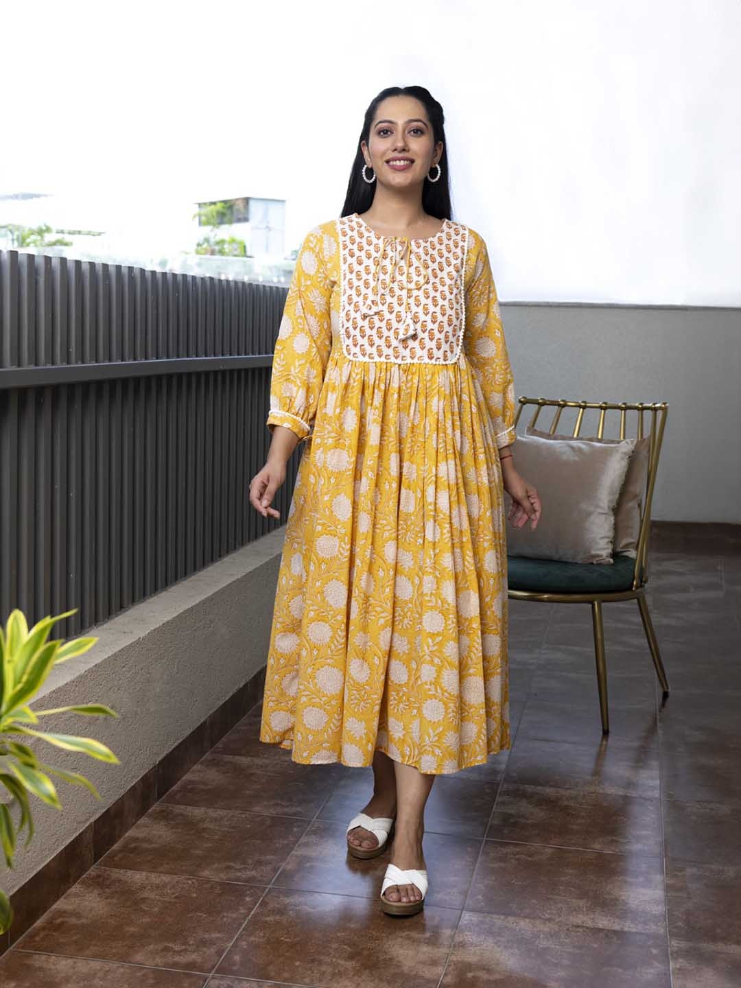 

Mulmul Floral Printed Tie Up Neck Cotton Fit and Flare Midi Ethnic Dress, Mustard