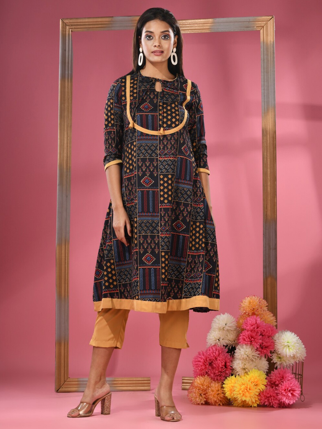 

Charukriti Floral Printed Tie-Up Neck Knee Length A-Line Kurta with Trousers, Black