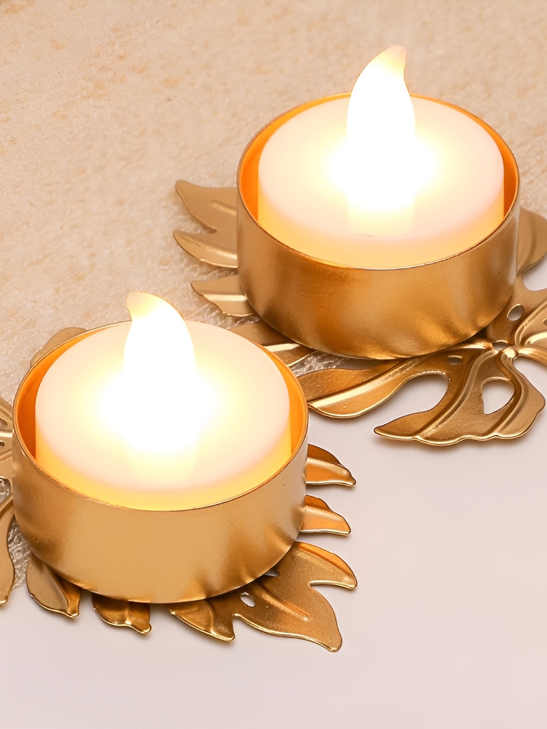 

Satyam Kraft Gold Toned 2 Pieces Textured Candle Holders