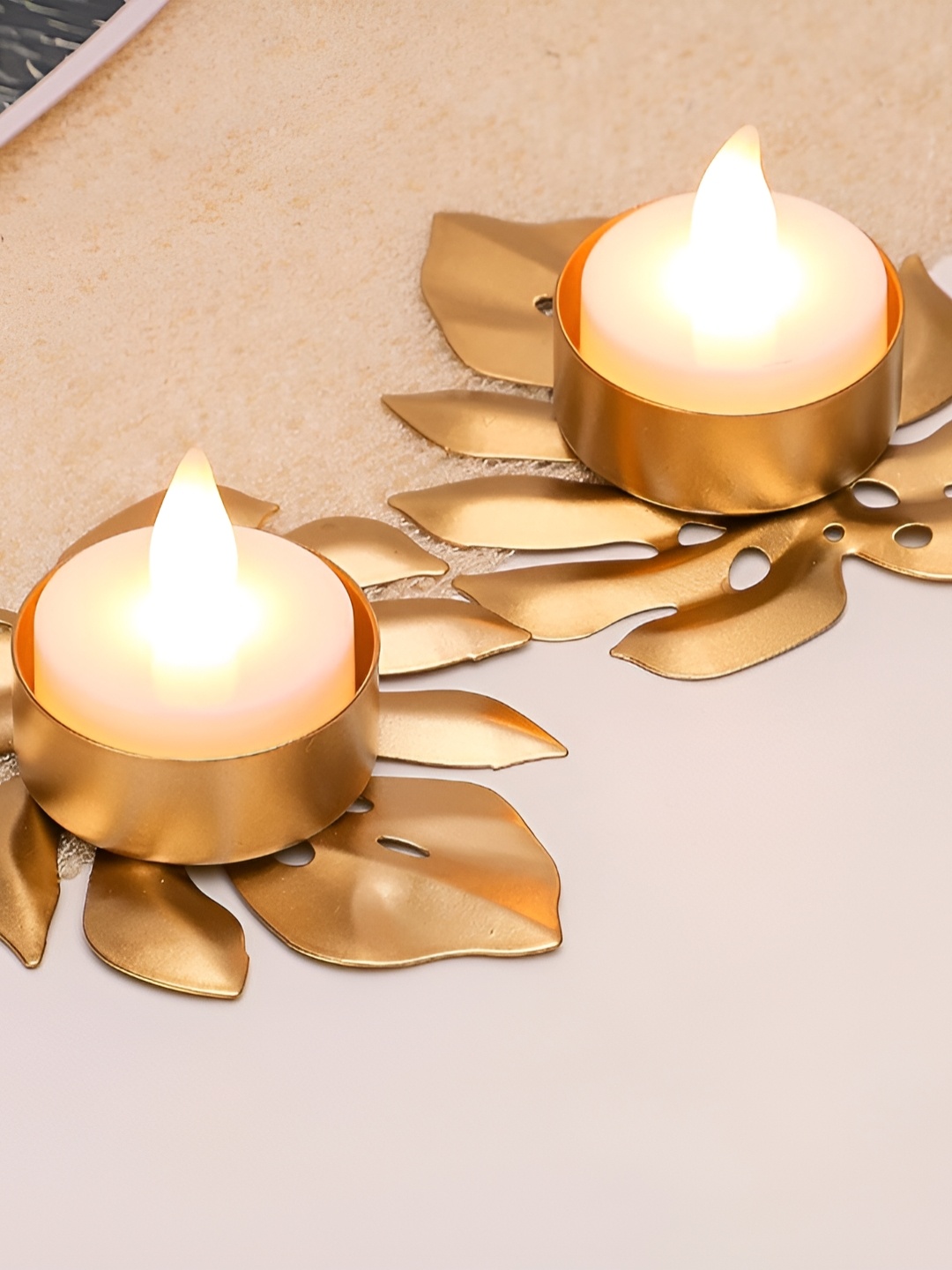 

Satyam Kraft Gold Toned 2 Pieces Textured Candle Holders