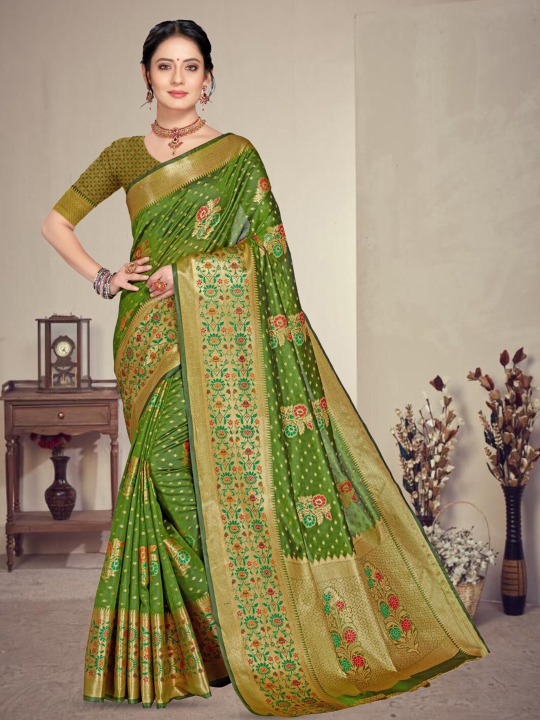

Mitera Olive reen & Gold toned Woven Design Zari Organza Banarasi Saree