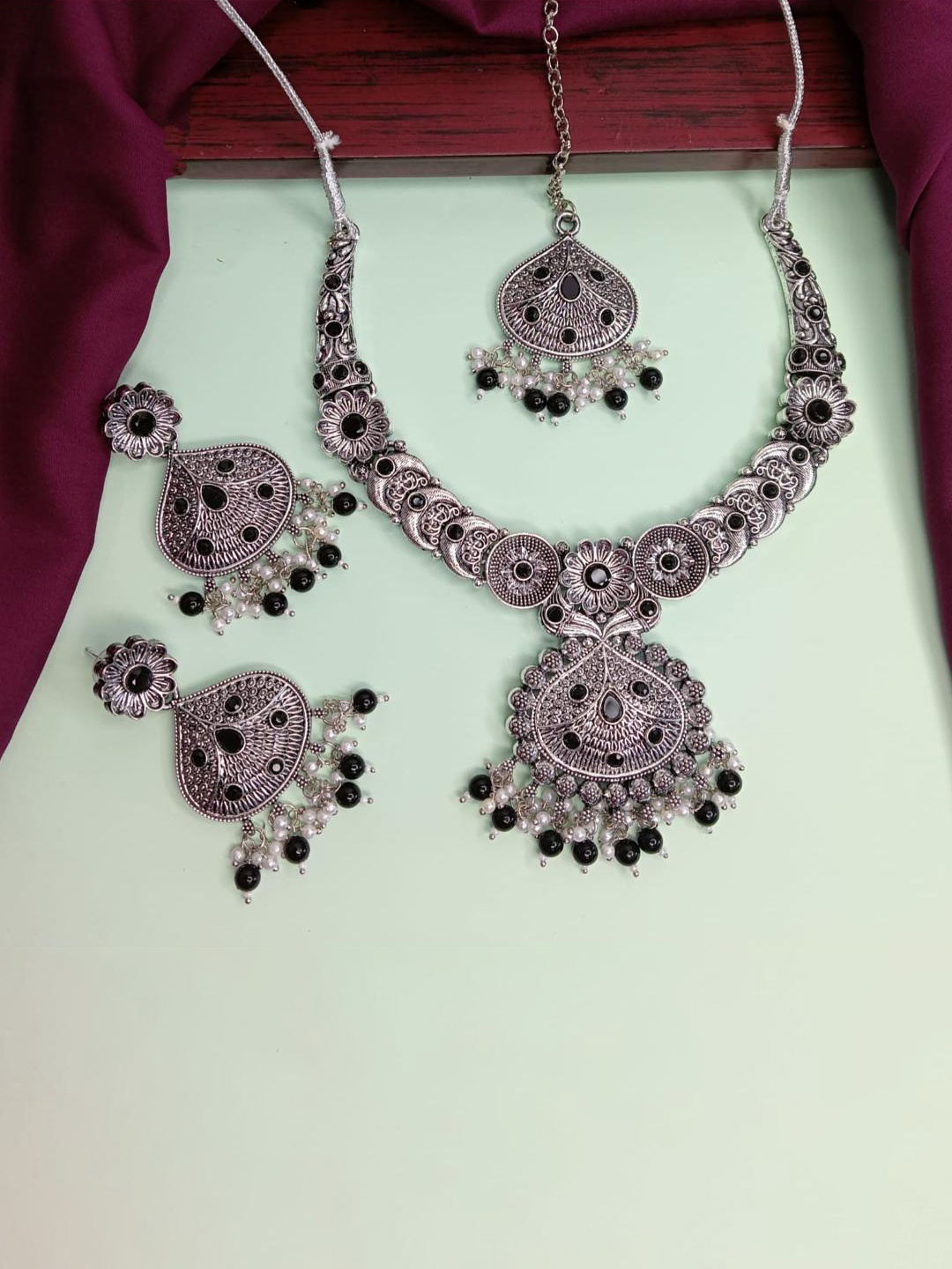 

Efulgenz Rhodium-Plated Oxidized Crystals Studded Antique Jewellery Set, Silver