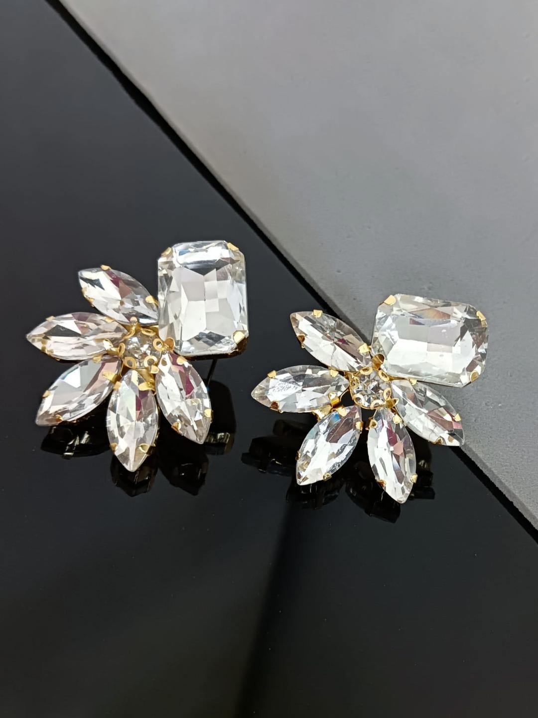 

Efulgenz Gold-Plated Crystals Studded Floral Shaped Drop Earrings
