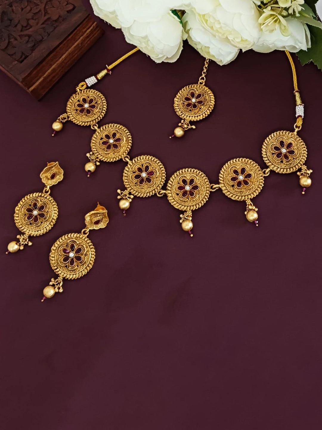 

Efulgenz Gold-Plated Crystals Studded Antique Jewellery Set