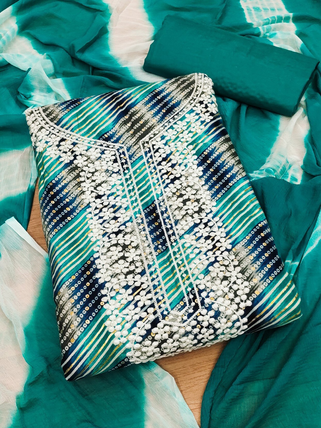 

KALINI Teal & White Bandhani Printed Embellished Unstitched Dress Material