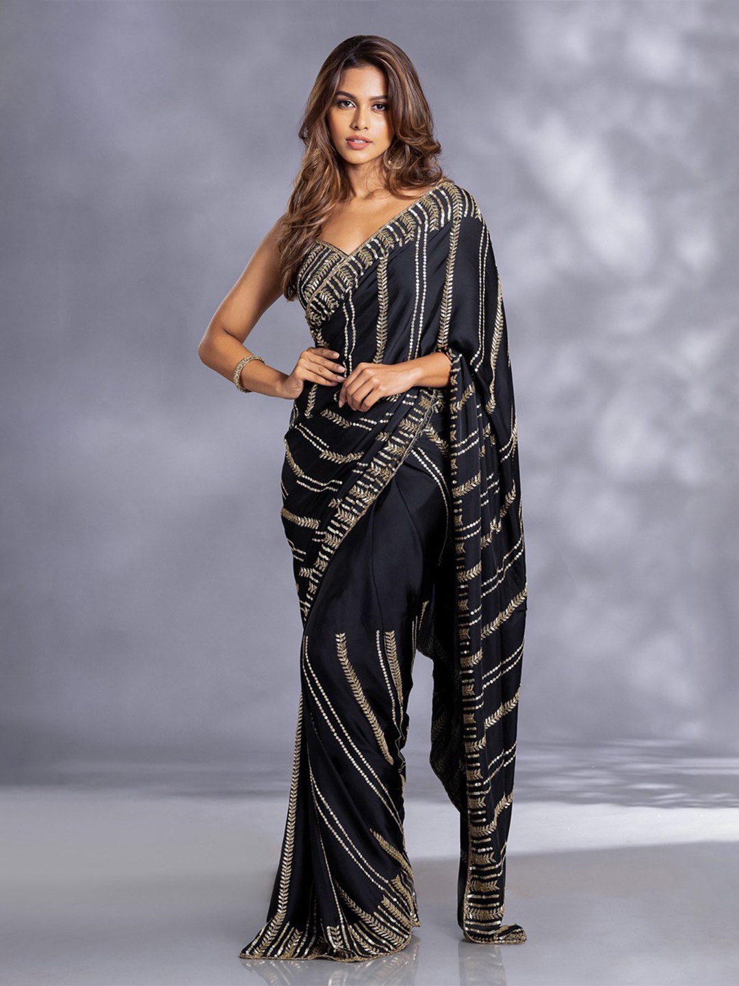 

FABIAN FASHION Black & GoldToned Embellished Sequinned Pure Georgette Saree