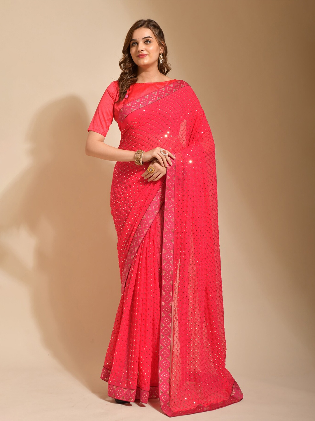 

FABIAN FASHION Pink & GoldToned Embellished Sequinned Pure Georgette Saree