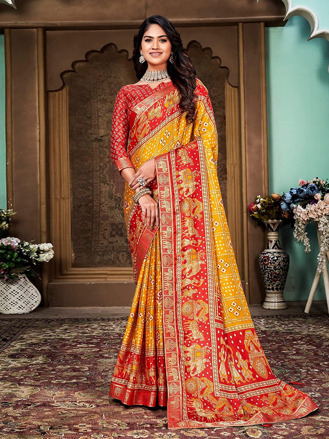 

Mitera Yellow & Orange Bandhani Zari Silk Cotton Saree