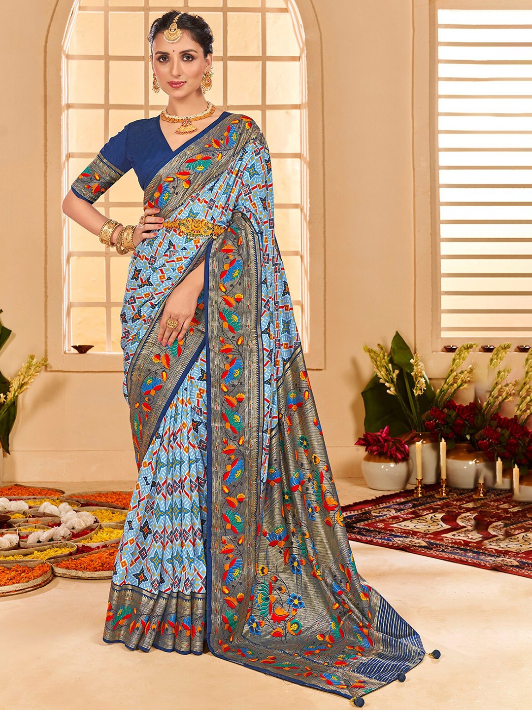 

Mitera Blue & Orange Floral Printed Zari Silk Cotton Saree