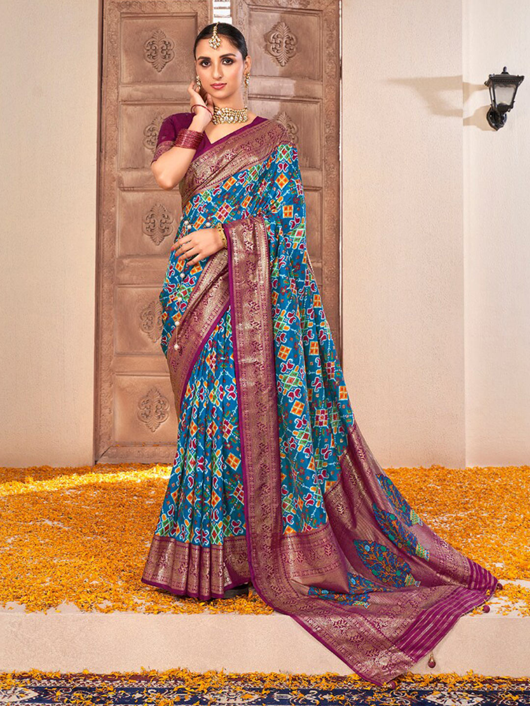 

Mitera Blue & Purple Ethnic Print Zari Silk Cotton Saree