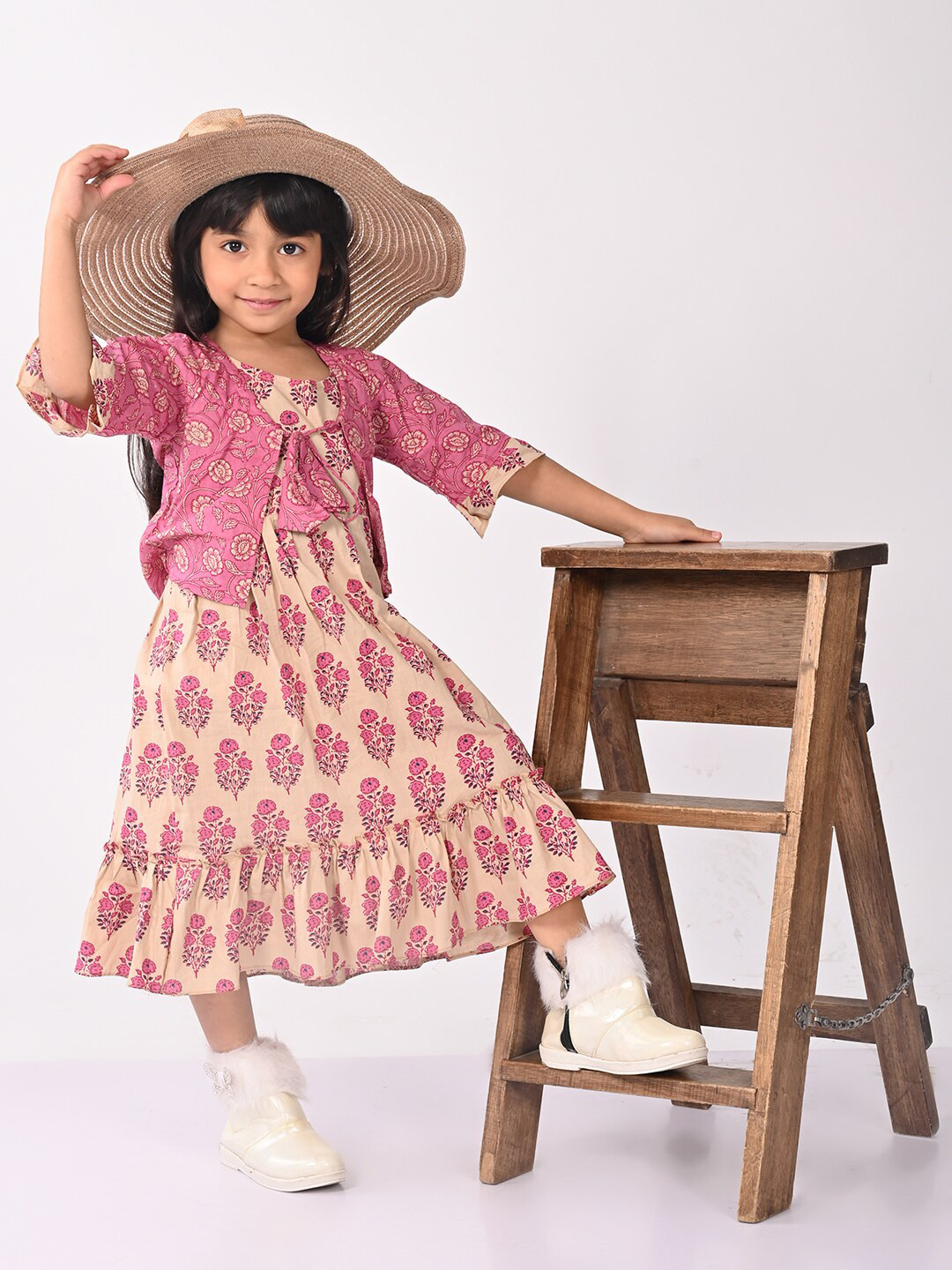 

Kinder Kids Pink Ethnic Motifs Printed Tie-Up Neck Flared Sleeve Cotton A-Line Midi Dress