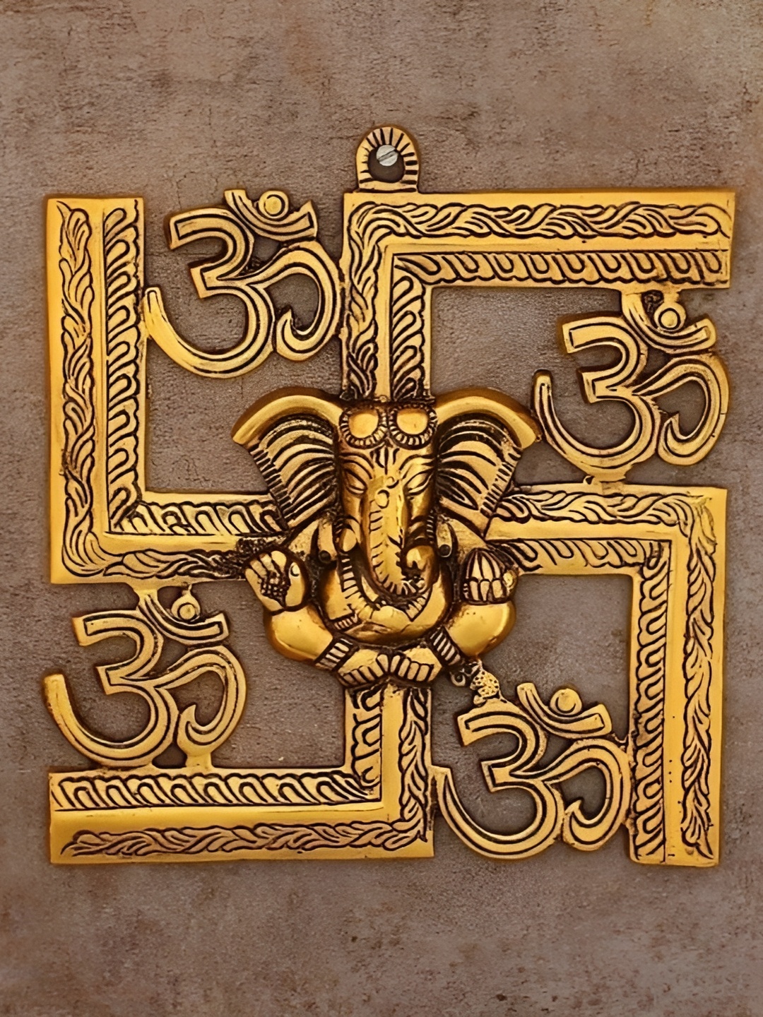 

Navyaksh Gold Toned Lord Ganesha Swastika Om Symbol Brass Idol Showpiece