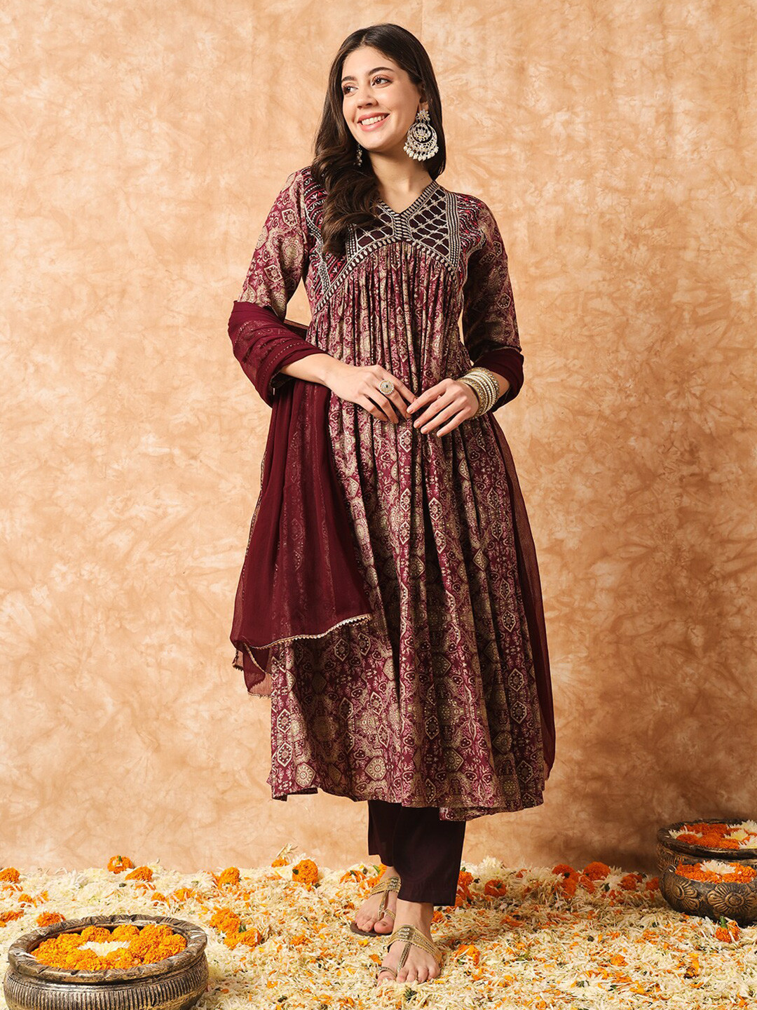 

Navlik Floral Printed Thread Work V-Neck Empire A-Line Kurta with Trousers & With Dupatta, Purple