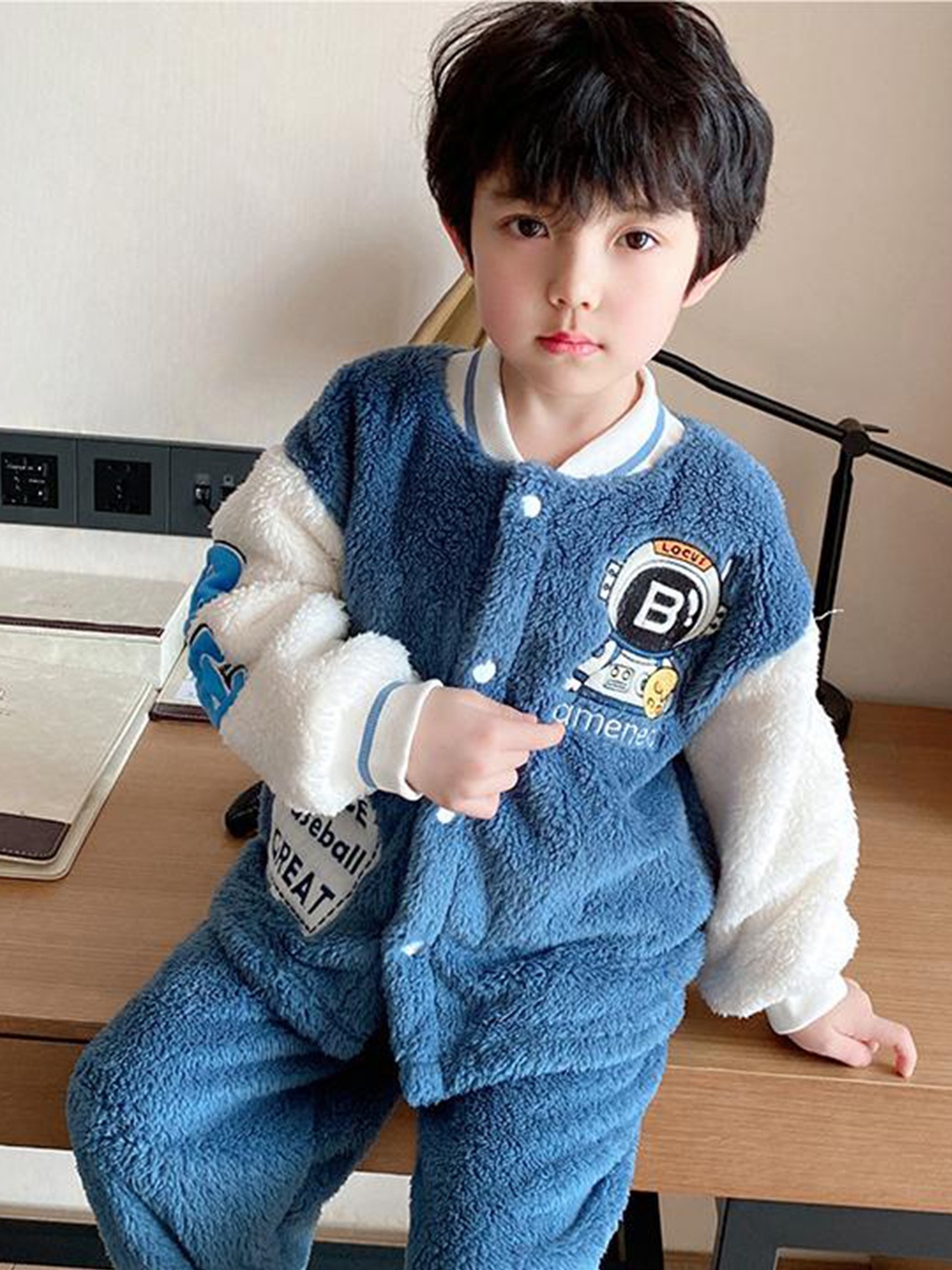 

StyleCast Boys Blue Self Design Stand Collar Jacket with Joggers