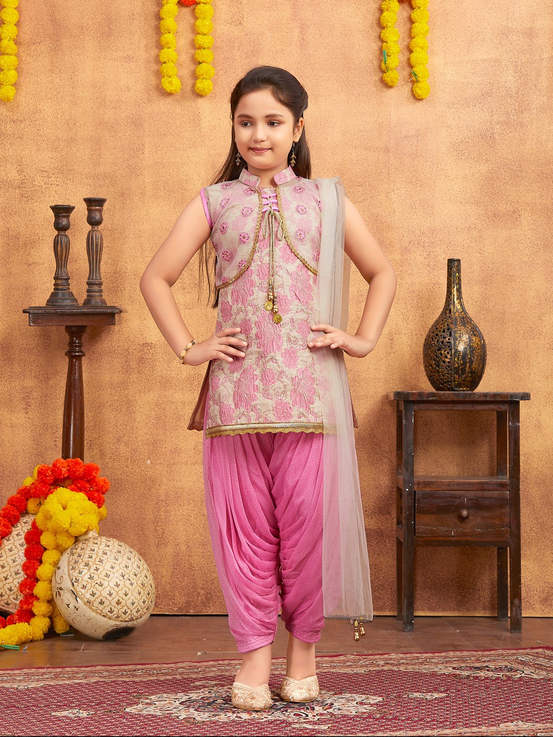 

Aarika Girls Floral Printed Embellished Mandarin Collar Kurta With Dhoti Pants & Dupatta, Pink