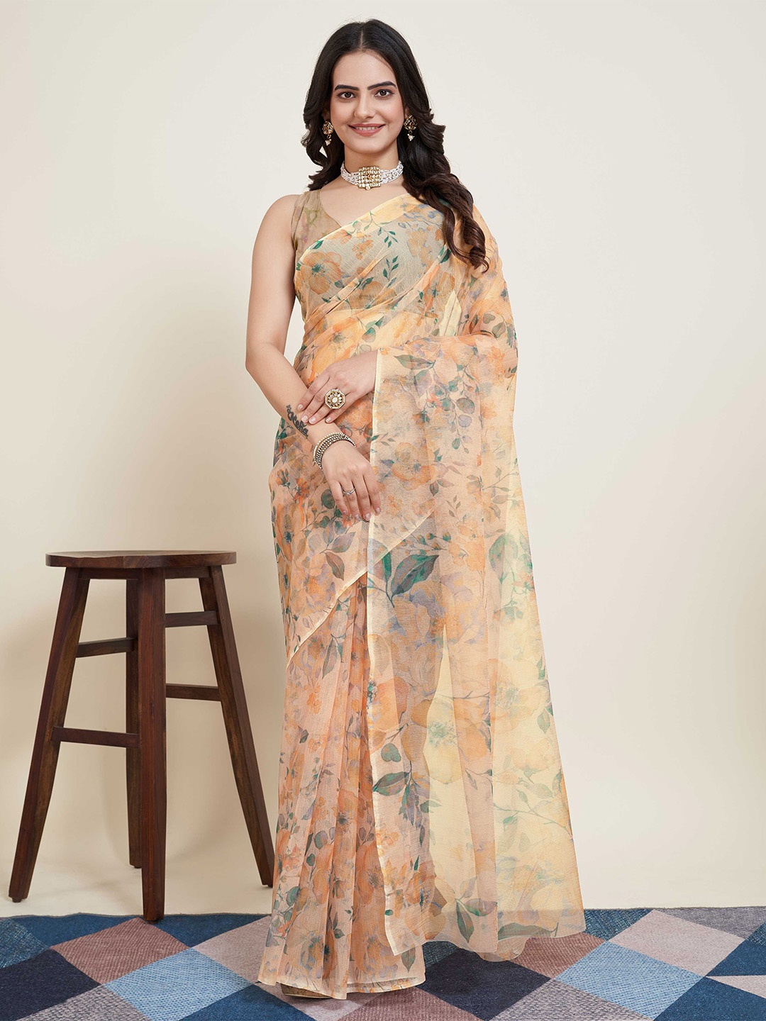 

Mitera Peach Coloured & Green Floral Supernet Saree With Unstitched Blouse Piece