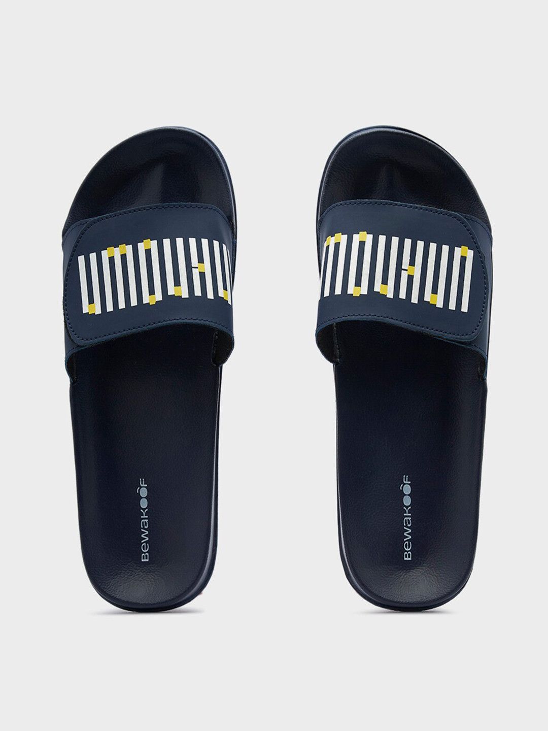

Bewakoof Men Unknown Printed Rubber Sliders, Blue