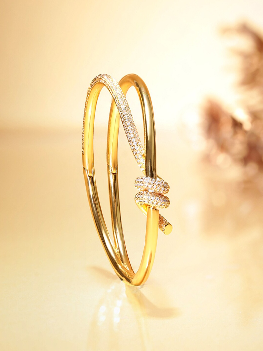 

Rubans Voguish Gold-Plated Cubic Zirconia Stone Studded Cuff Bracelet