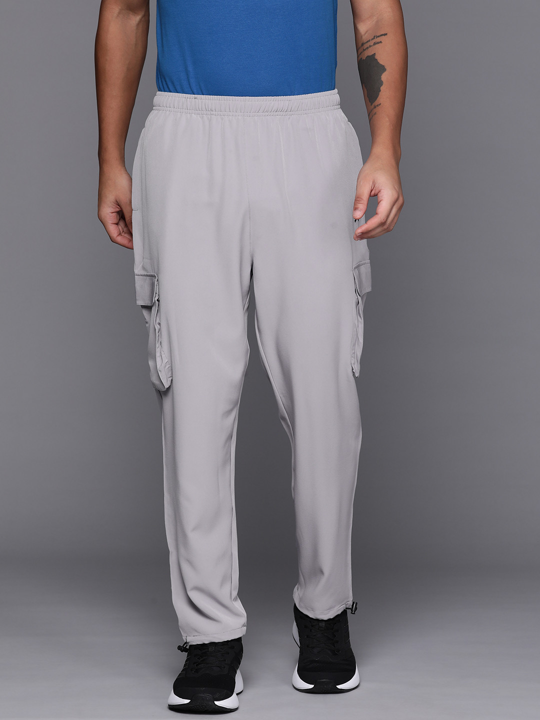

HRX by Hrithik Roshan Men Solid Regular Fit Cargo Track Pants, Grey