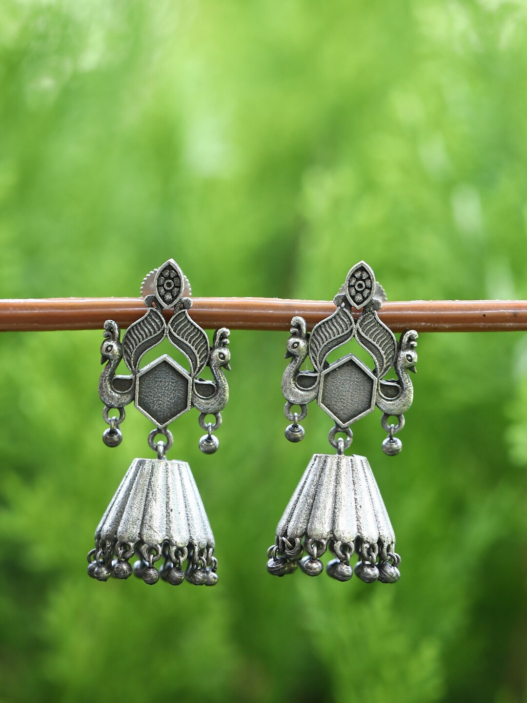 

Sangria Silver Plated Oxidised Peacock Shaped Jhumkas