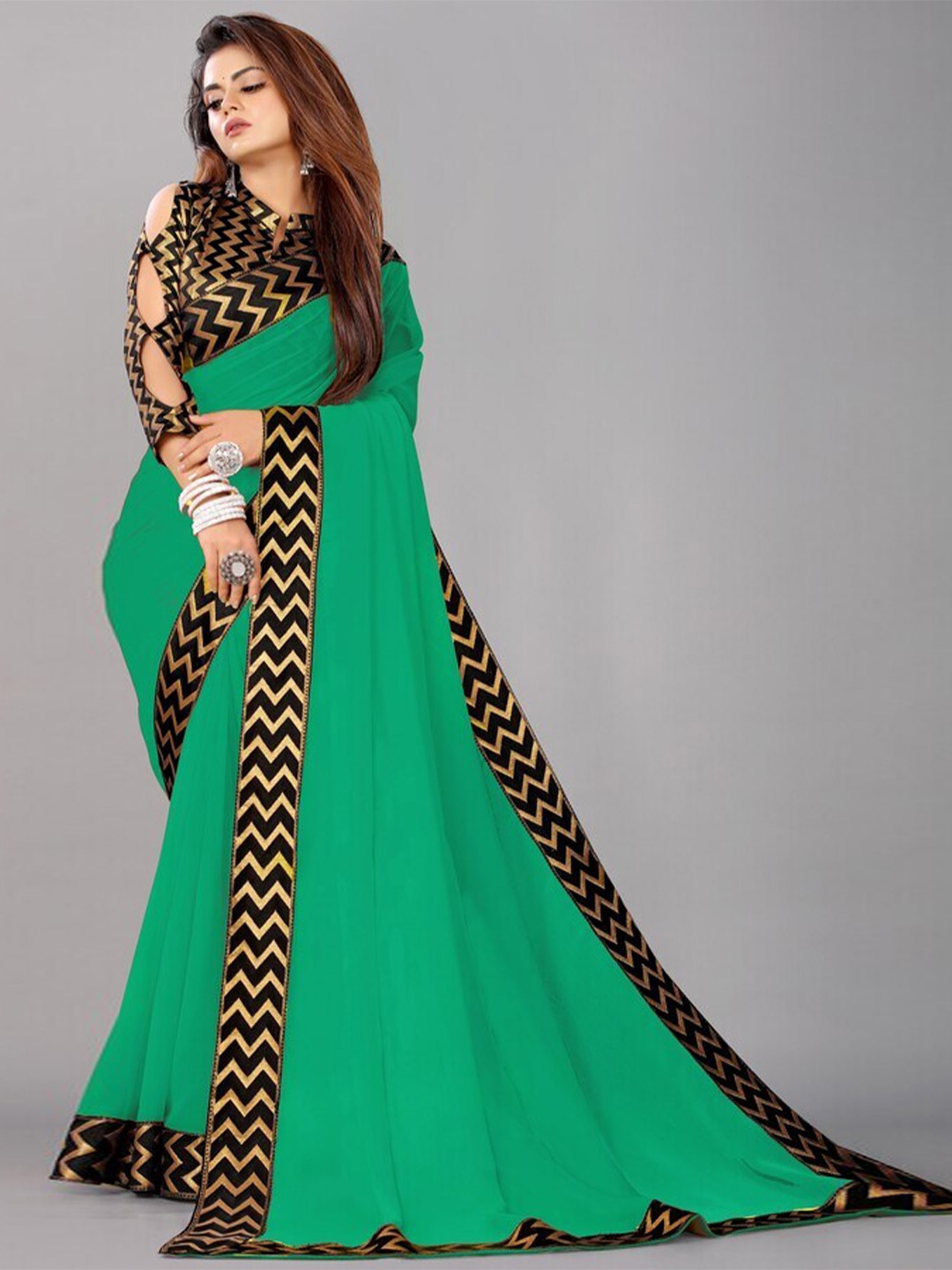 

Flip The Style Green & Black Zari Pure Georgette Saree