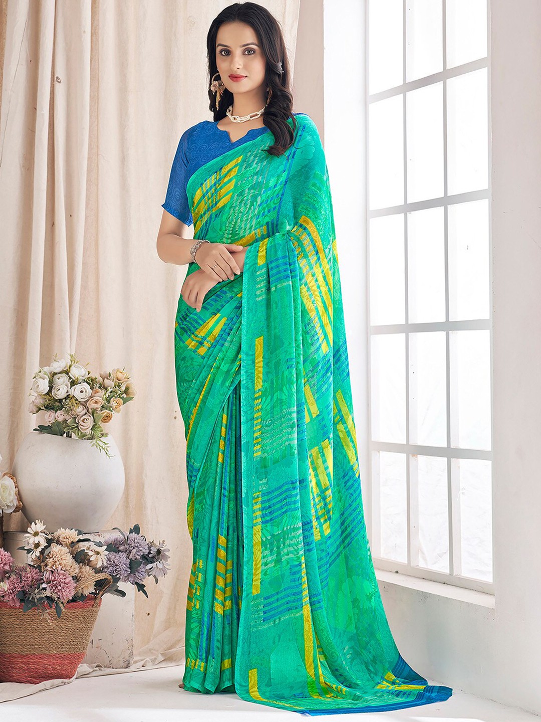 

Mitera Abstract Printed Pure Chiffon Bagru Saree, Teal