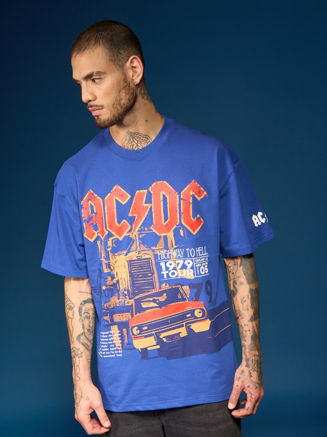

Bonkers Corner Humour and Comic Printed Cotton Raw Edge Oversized T-shirt, Blue