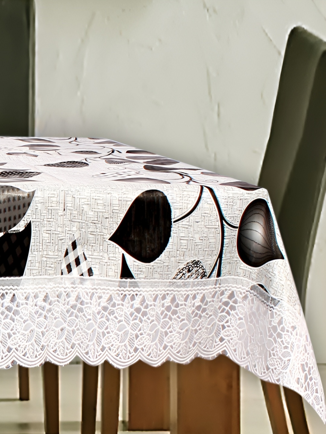 

Stylista White & Black Floral Printed Waterproof Rectangular 12 Seater Table Cover