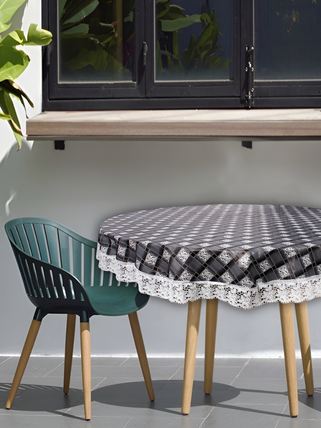 

Stylista Black & White Checked Waterproof Round 2 Seater Table Cover