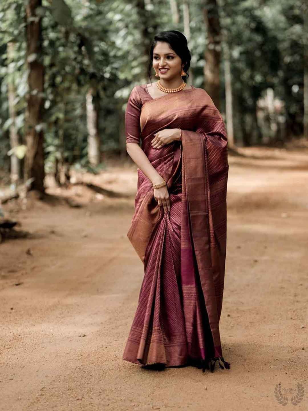 

Mitera Maroon & Gold Toned Woven Design Zari Art Silk Saree