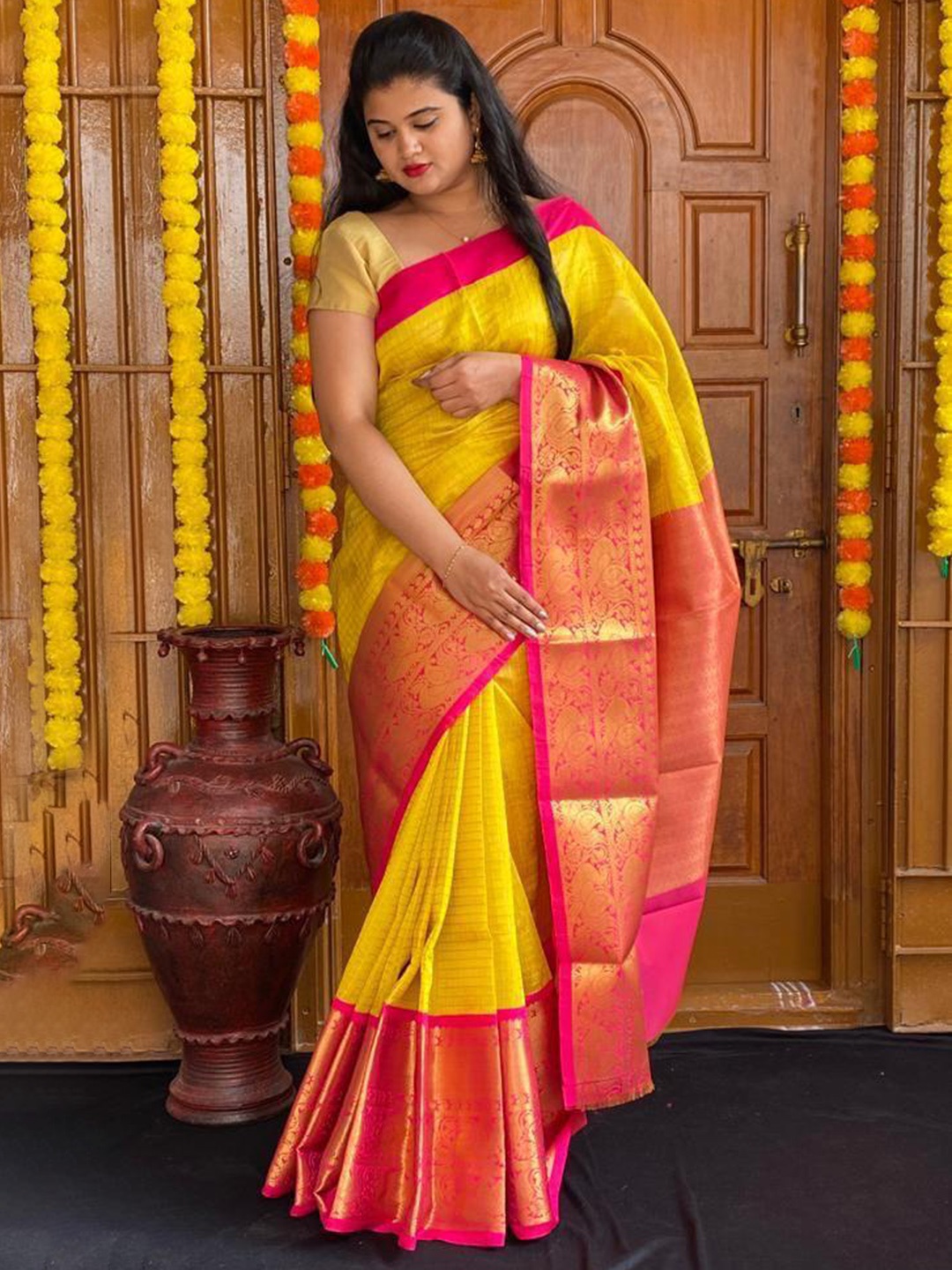 

Mitera Yellow & Pink Ethnic Motifs Woven Design Zari Art Silk Saree